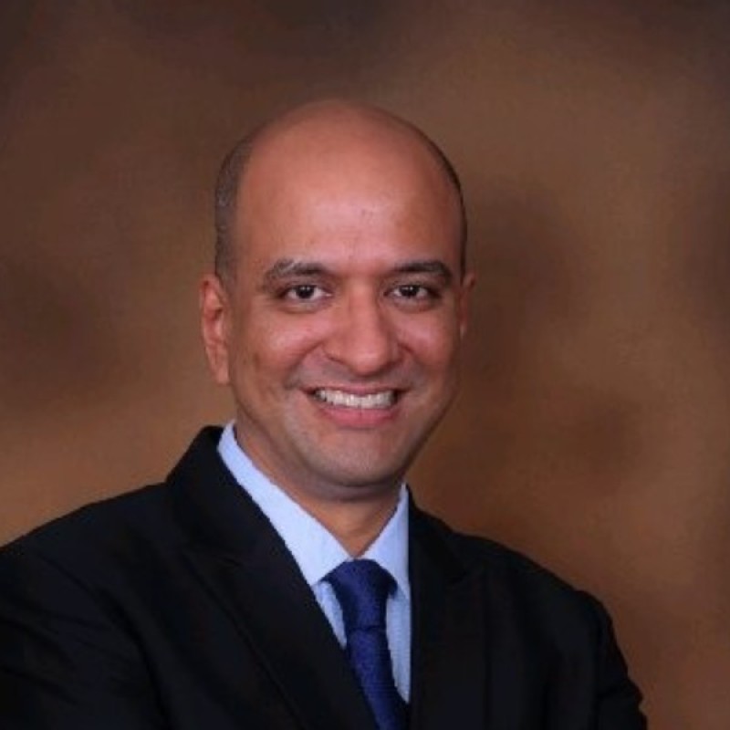 Portrait of Amit Garg, faculty at First Bridge Business School