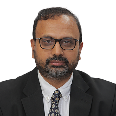 Portrait of Kaushik Mitra, faculty at First Bridge Business School
