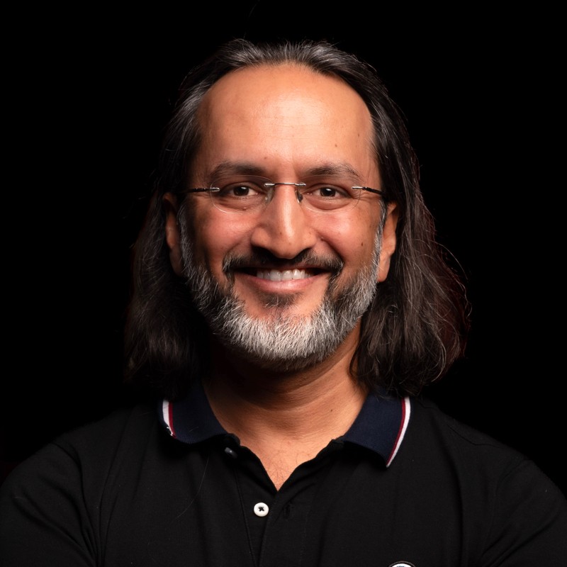 Portrait of Papa CJ, faculty at First Bridge Business School
