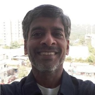Portrait of Ratan KK, faculty at First Bridge Business School